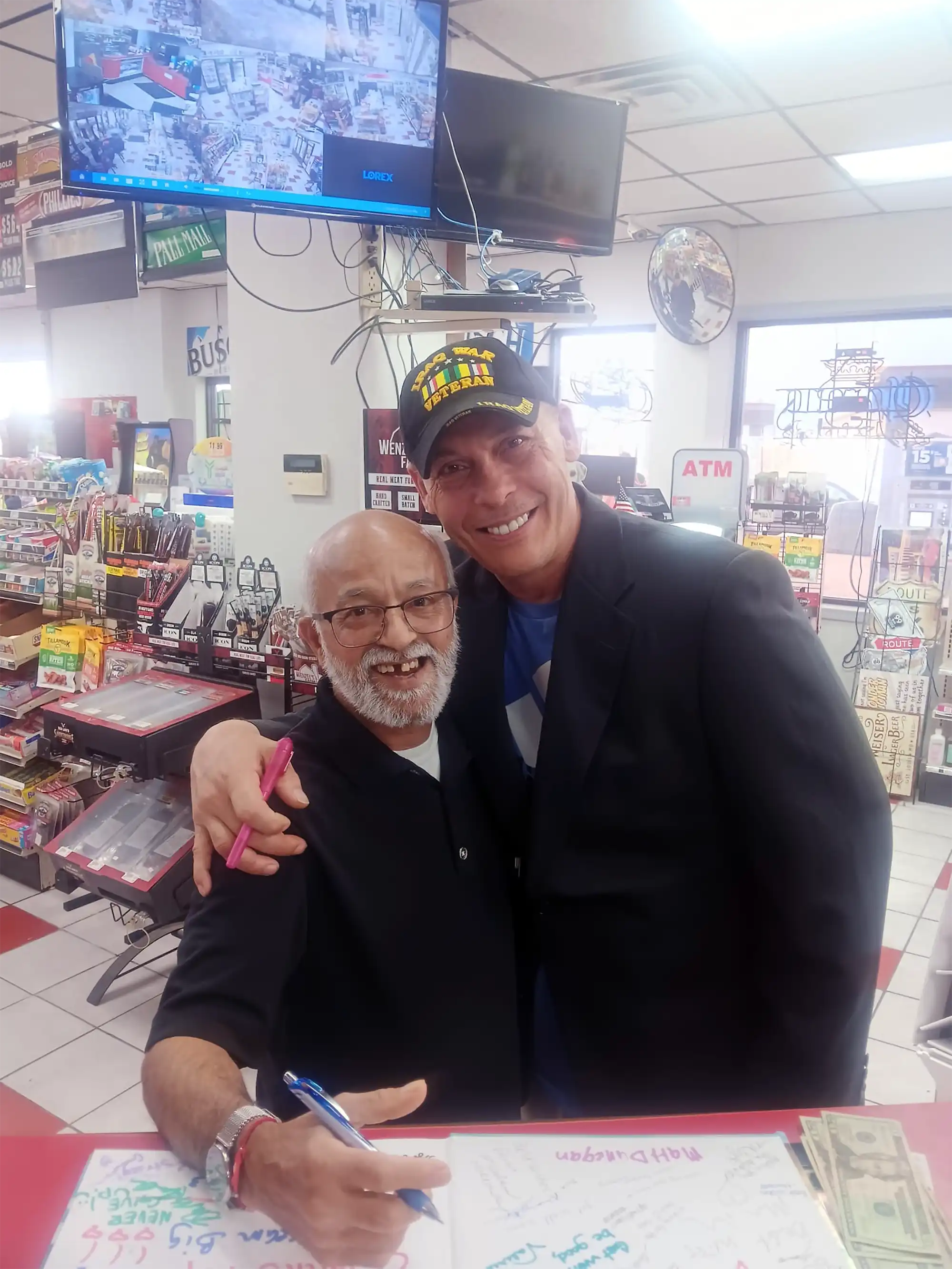 Two great friends, David Haave gives community love with local business owners, MO, USA.